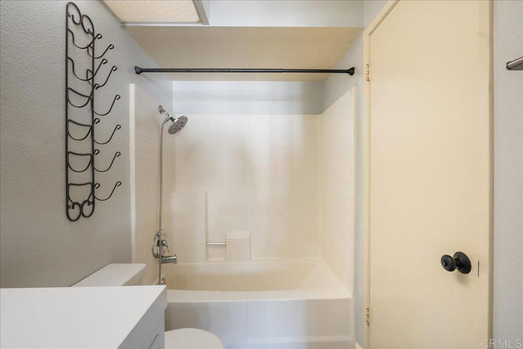 9829 Caspi Gardens Drive, Unit 6 Santee, CA 92071 - Photo 15 of 23 a bathroom with a shower and a bath tub