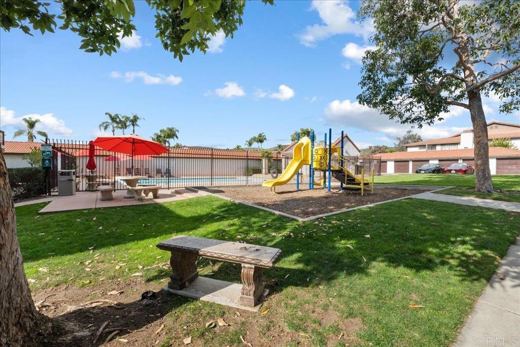 9829 Caspi Gardens Drive, Unit 6 Santee, CA 92071 - Photo 20 of 23 a view of a park with swings and slides