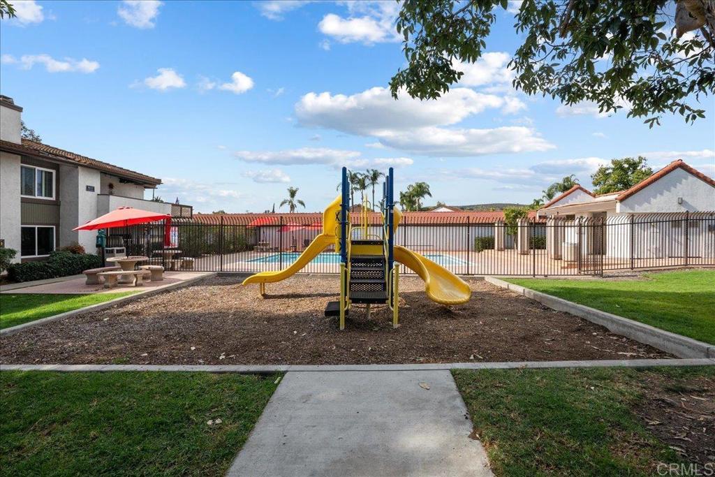 9829 Caspi Gardens Drive, Unit 6 Santee, CA 92071 - Photo 21 of 23 a view of outdoor space with playground and green space