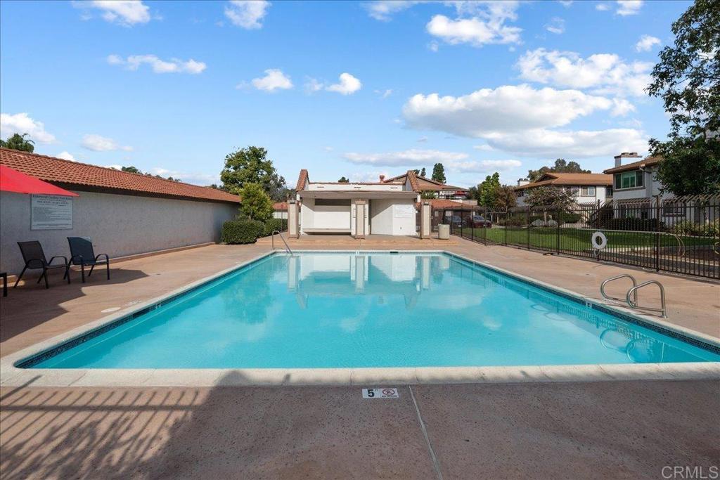 9829 Caspi Gardens Drive, Unit 6 Santee, CA 92071 - Photo 22 of 23 a view of a swimming pool with a lounge chair