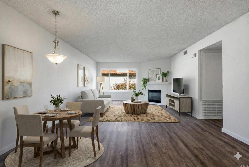9829 Caspi Gardens Drive, Unit 6 Santee, CA 92071 - Photo 3 of 23 a view of a dining room with furniture window and wooden floor