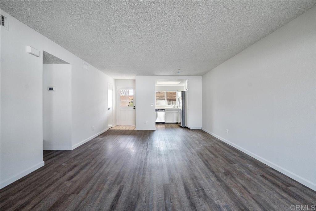 9829 Caspi Gardens Drive, Unit 6 Santee, CA 92071 - Photo 6 of 23 a view of empty room with wooden floor