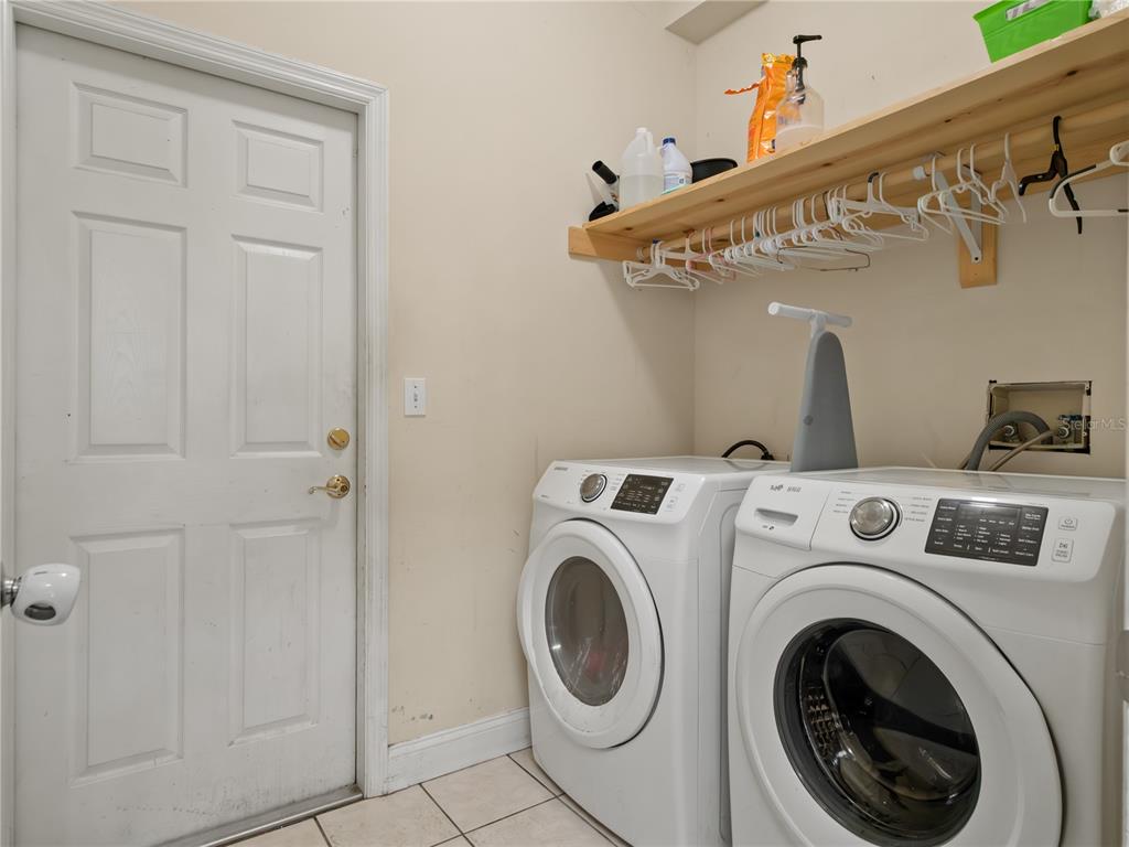 834 High Pointe Circle Minneola, FL 34715 - Photo 11 of 15 a utility room with dryer and washer