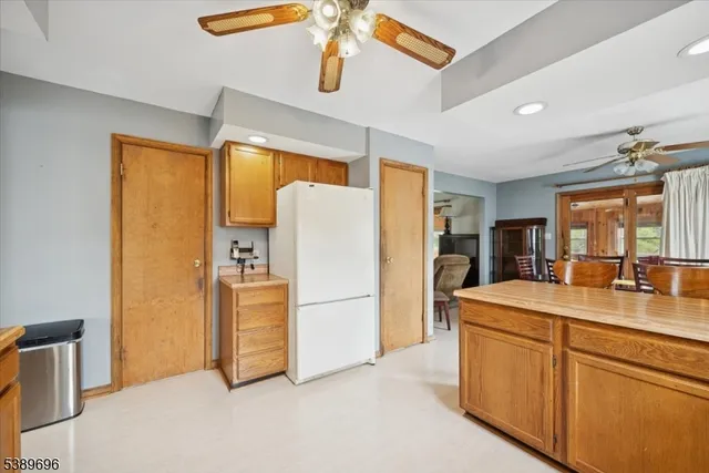 a dining room with furniture a window and wooden floor