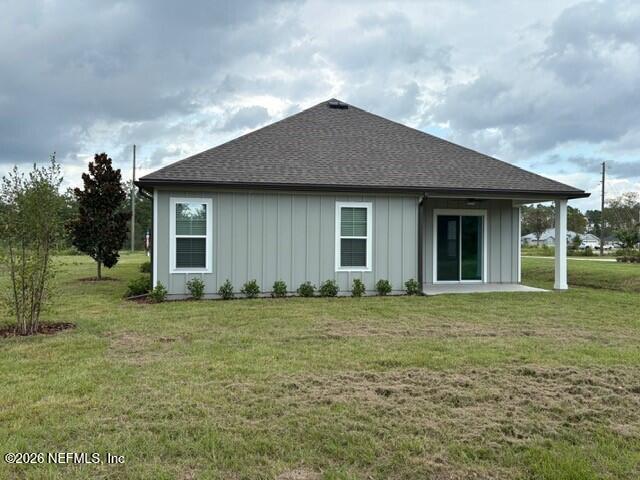 8911 Ford Road Bryceville, FL 32009 - Photo 14 of 15 a house that has a big yard