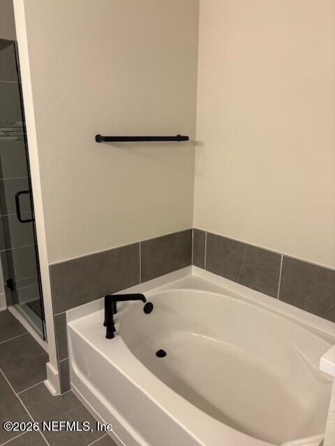 8911 Ford Road Bryceville, FL 32009 - Photo 9 of 15 a bathroom with a bathtub