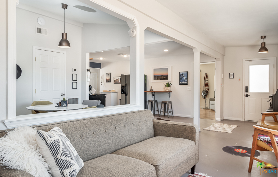 60525 Security Drive Joshua Tree, CA 92252 - Photo 2 of 39 a living room with furniture and a large mirror