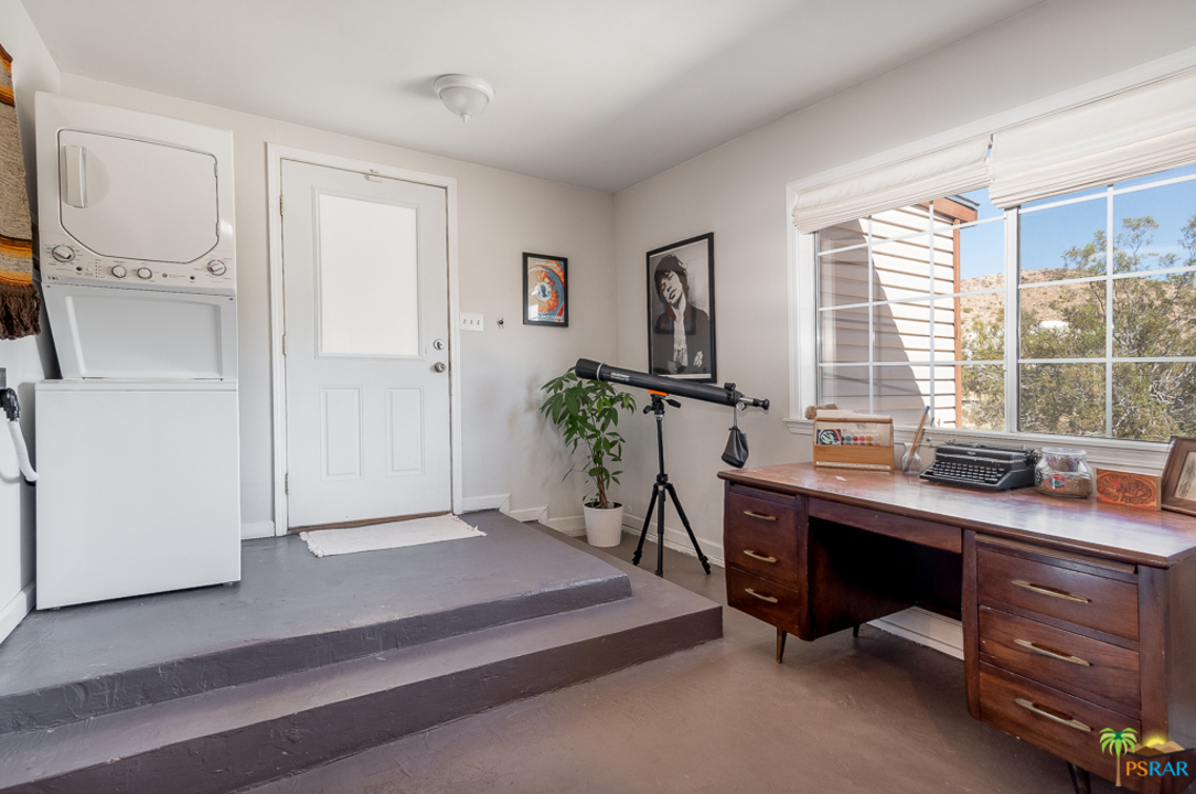 60525 Security Drive Joshua Tree, CA 92252 - Photo 11 of 39 a view of a workspace with furniture and a window