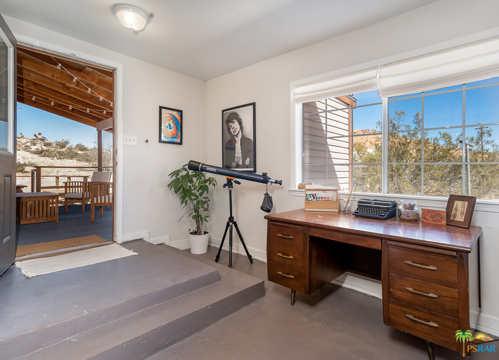 60525 Security Drive Joshua Tree, CA 92252 - Photo 12 of 39 a room with a table chair and window