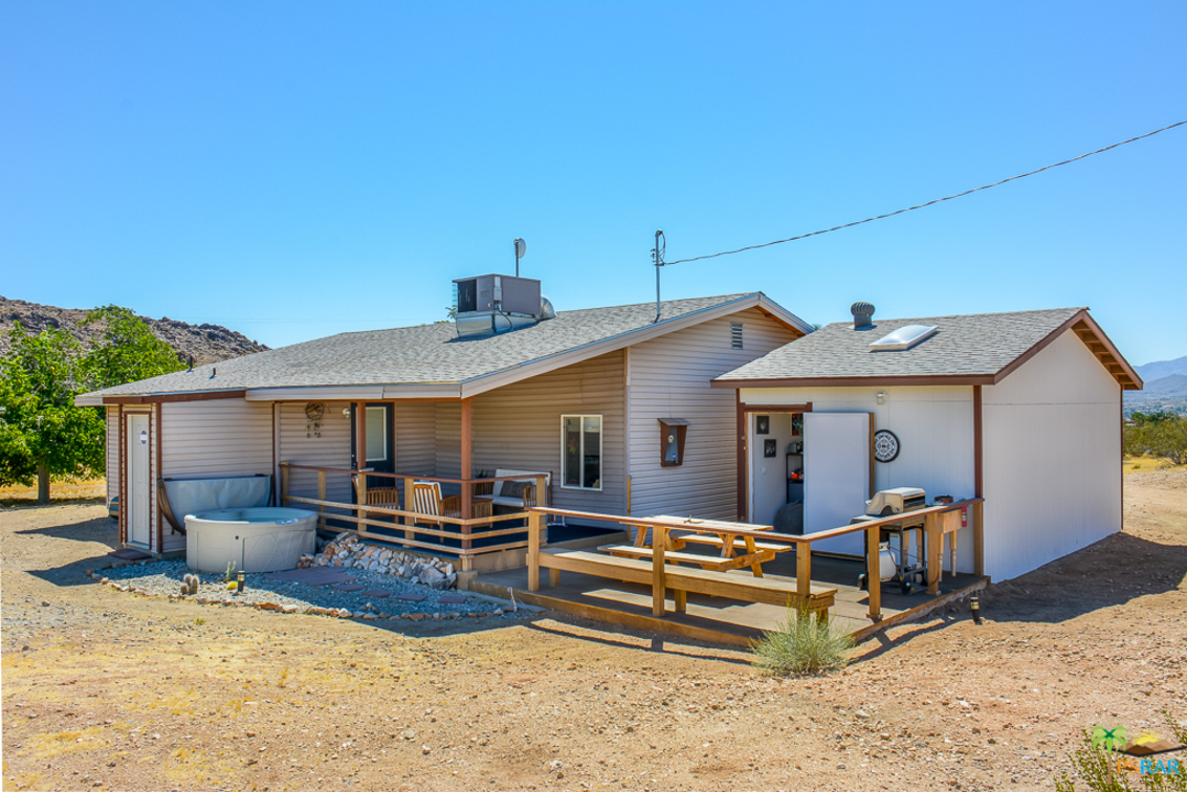 60525 Security Drive Joshua Tree, CA 92252 - Photo 26 of 39 a view of a house with a patio