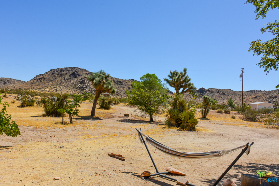 60525 Security Drive Joshua Tree, CA 92252 - Photo 32 of 39 a view of a backyard of a house