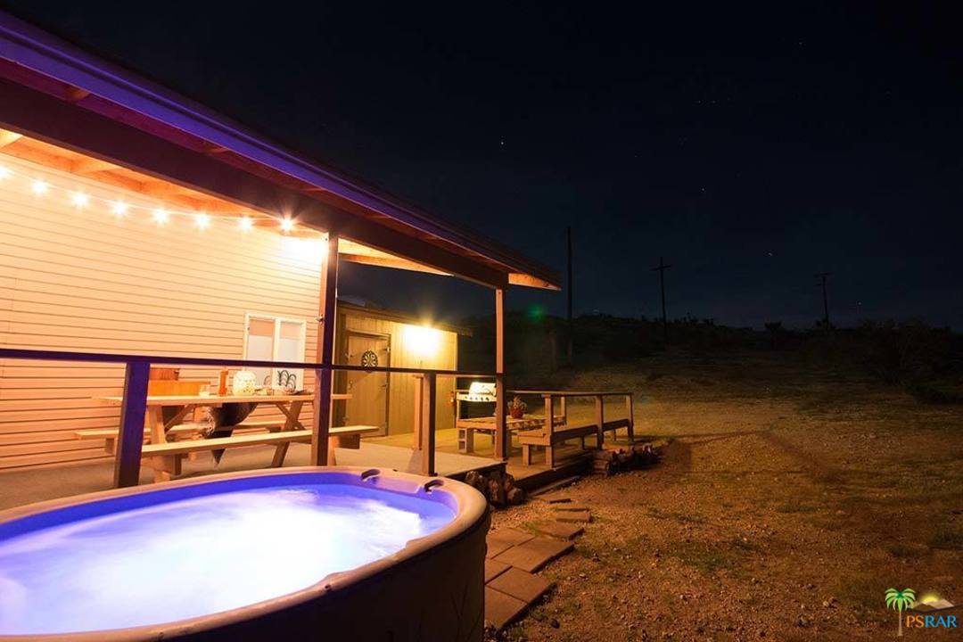 60525 Security Drive Joshua Tree, CA 92252 - Photo 34 of 39 a view of swimming pool with seating area