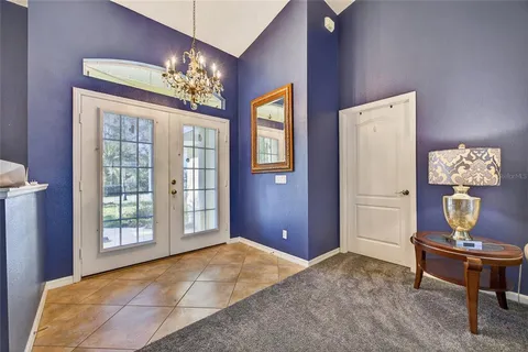 a bedroom with a bed and dresser with mirror