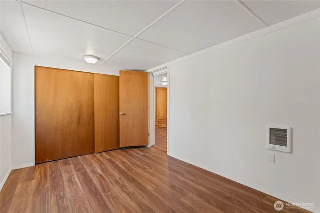 a view of hallway with wooden floor