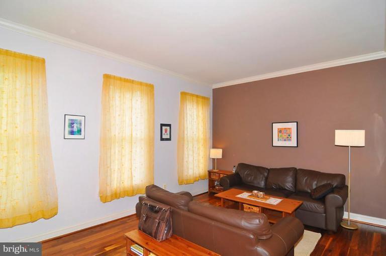 9404 Regency Crest Drive Vienna, VA 22181 - Photo 2 of 30 a living room with furniture and wooden floor