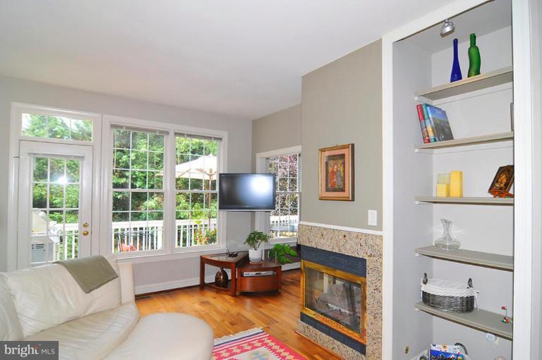 9404 Regency Crest Drive Vienna, VA 22181 - Photo 11 of 30 a living room with furniture and a fireplace