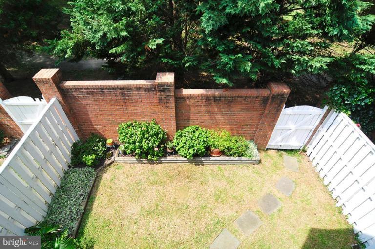 9404 Regency Crest Drive Vienna, VA 22181 - Photo 16 of 30 a view of a fountain in the backyard with potted plants