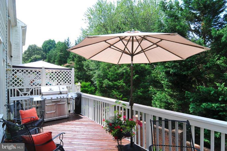 9404 Regency Crest Drive Vienna, VA 22181 - Photo 17 of 30 a view of a patio with furniture and a backyard