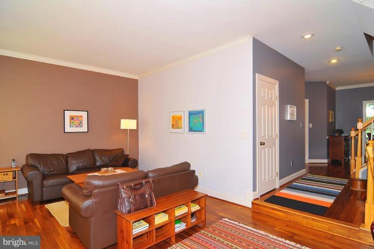 9404 Regency Crest Drive Vienna, VA 22181 - Photo 3 of 30 a living room with a bed and a couch