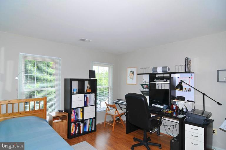 9404 Regency Crest Drive Vienna, VA 22181 - Photo 23 of 30 a view of a workspace with furniture and a window