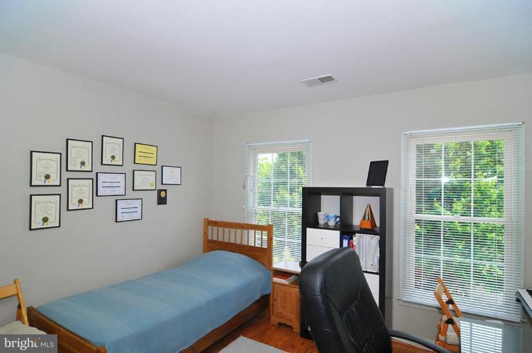 9404 Regency Crest Drive Vienna, VA 22181 - Photo 24 of 30 a view of a livingroom with furniture and workspace