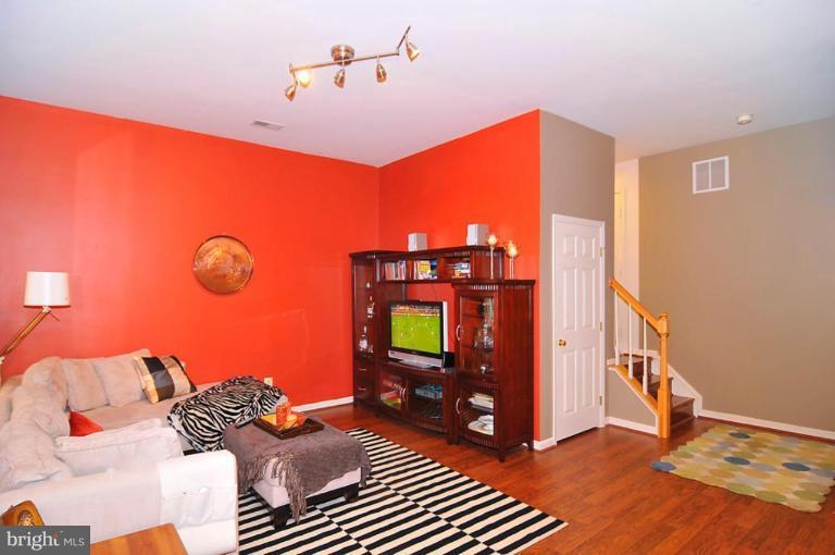 9404 Regency Crest Drive Vienna, VA 22181 - Photo 27 of 30 a living room with furniture and a flat screen tv