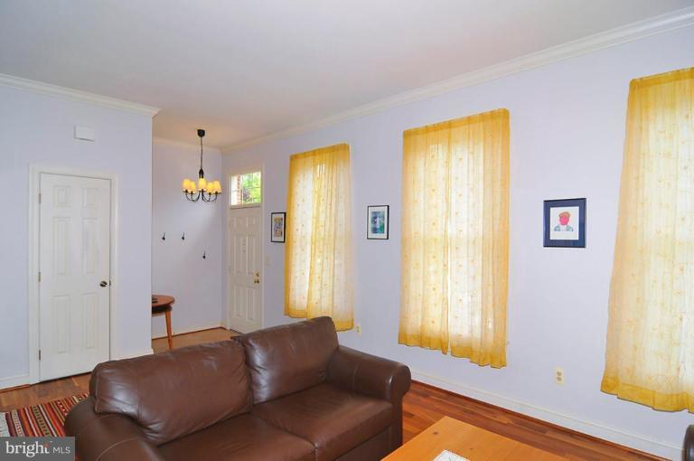 9404 Regency Crest Drive Vienna, VA 22181 - Photo 4 of 30 a living room with furniture and a window