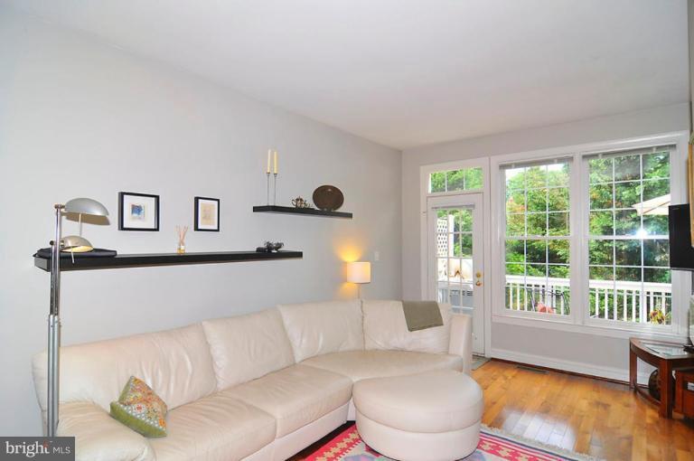 9404 Regency Crest Drive Vienna, VA 22181 - Photo 10 of 30 a living room with furniture and a large window