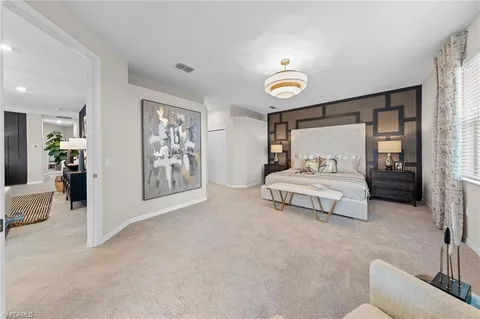 a large kitchen with kitchen island a sink a counter top space appliances and cabinets