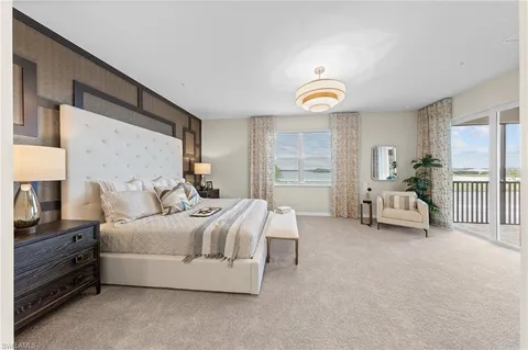 a kitchen with a dining table chairs stainless steel appliances and cabinets