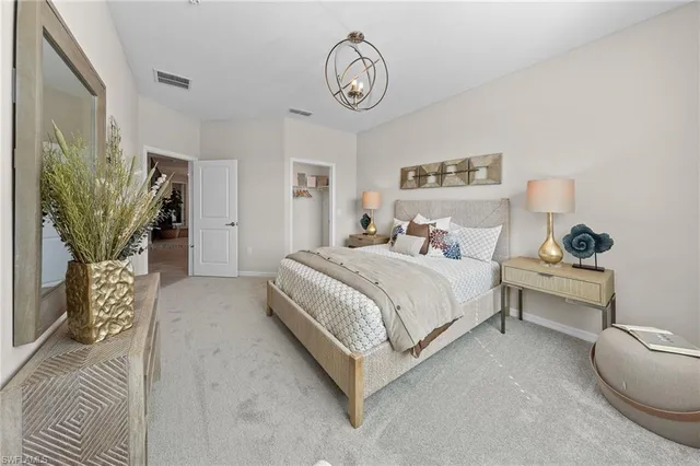 a bedroom with a bed and a table