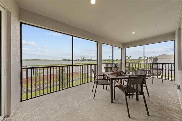a bedroom with bed and a potted plant