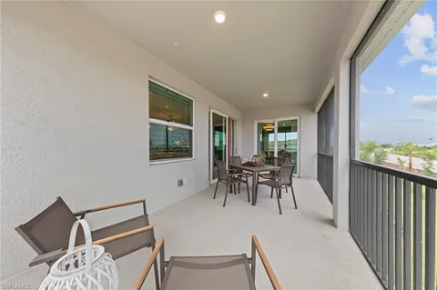 a bathroom with double vanity and a mirror