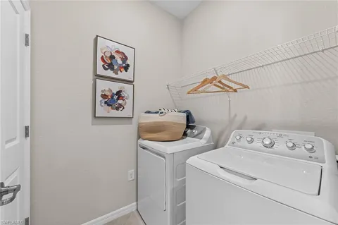 a view of a city from a balcony with furniture