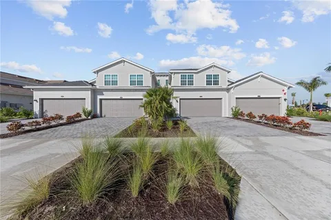a dining room with furniture and a window
