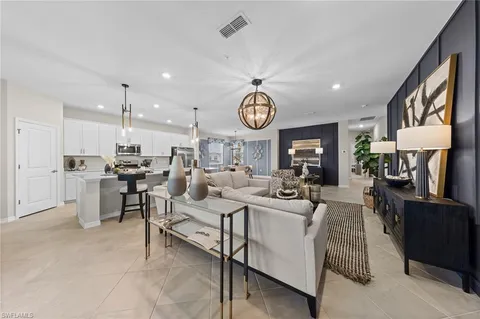 a living room with lots of furniture and a clock