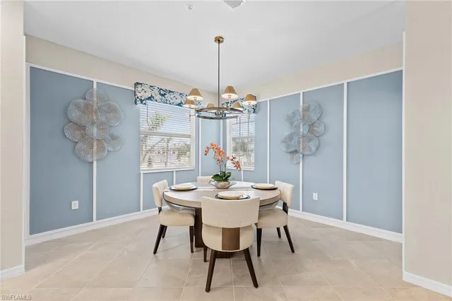 a dining room with furniture and window