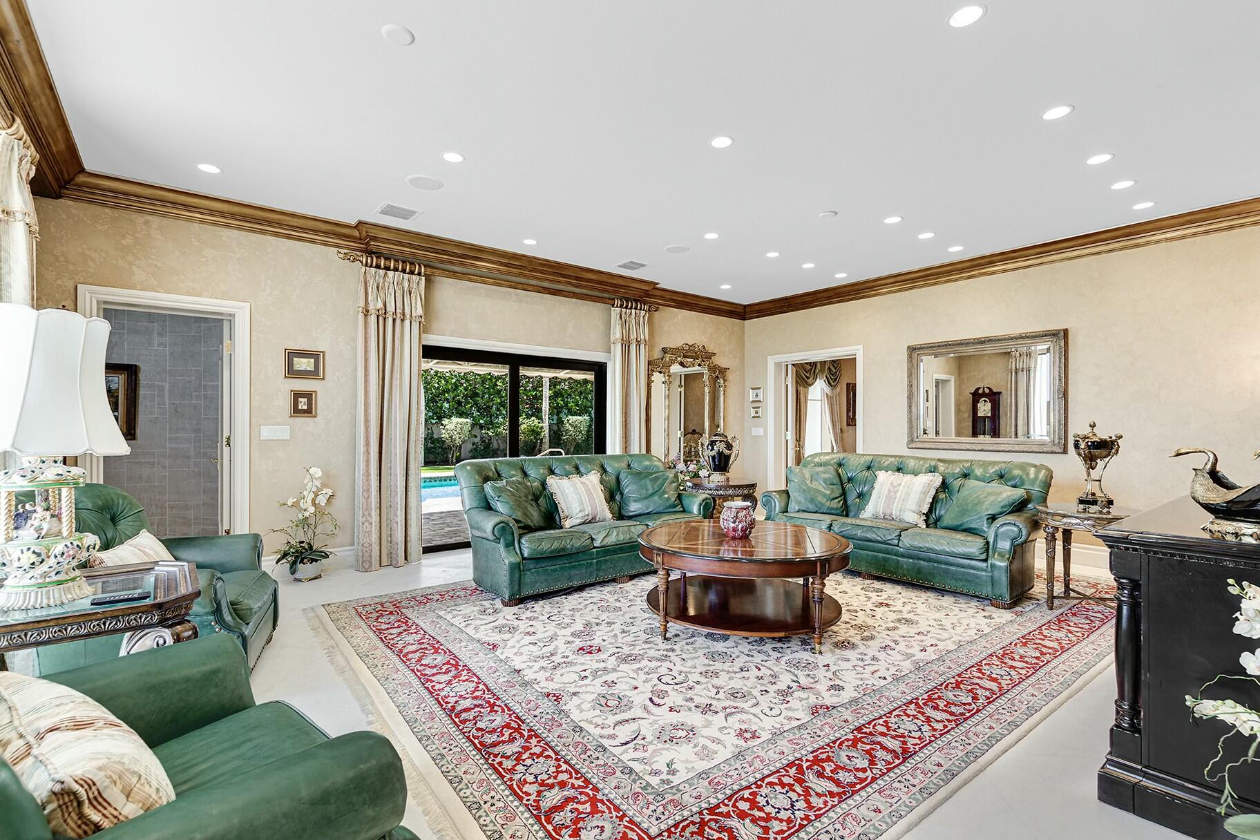 477 South Beach Road Jupiter Island, FL 33455 - Photo 16 of 54 a living room with furniture and a rug