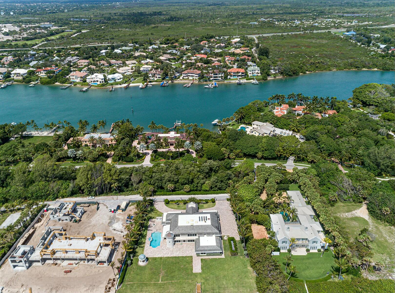 477 South Beach Road Jupiter Island, FL 33455 - Photo 6 of 54 an aerial view of river residential houses with outdoor space and swimming pool