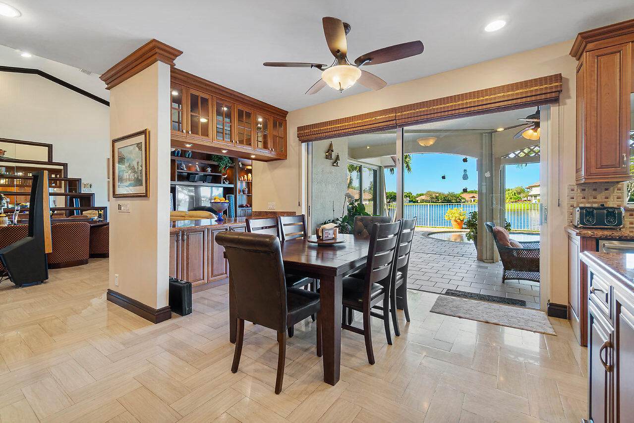 4407 Woodfield Boulevard Boca Raton, FL 33434 - Photo 15 of 37 a view of a dining room with furniture