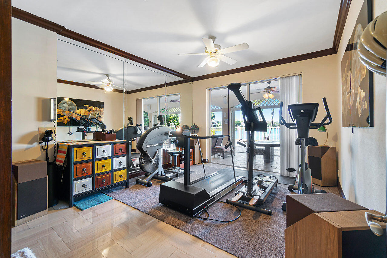4407 Woodfield Boulevard Boca Raton, FL 33434 - Photo 23 of 37 a view of a room with gym equipment
