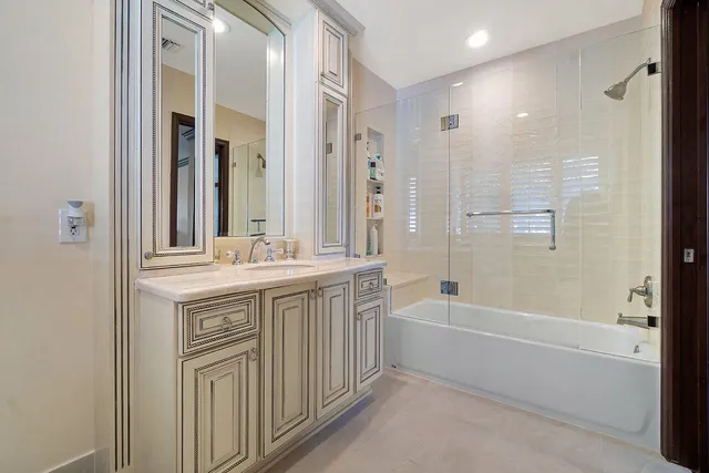 a living room with patio furniture and a floor to ceiling window