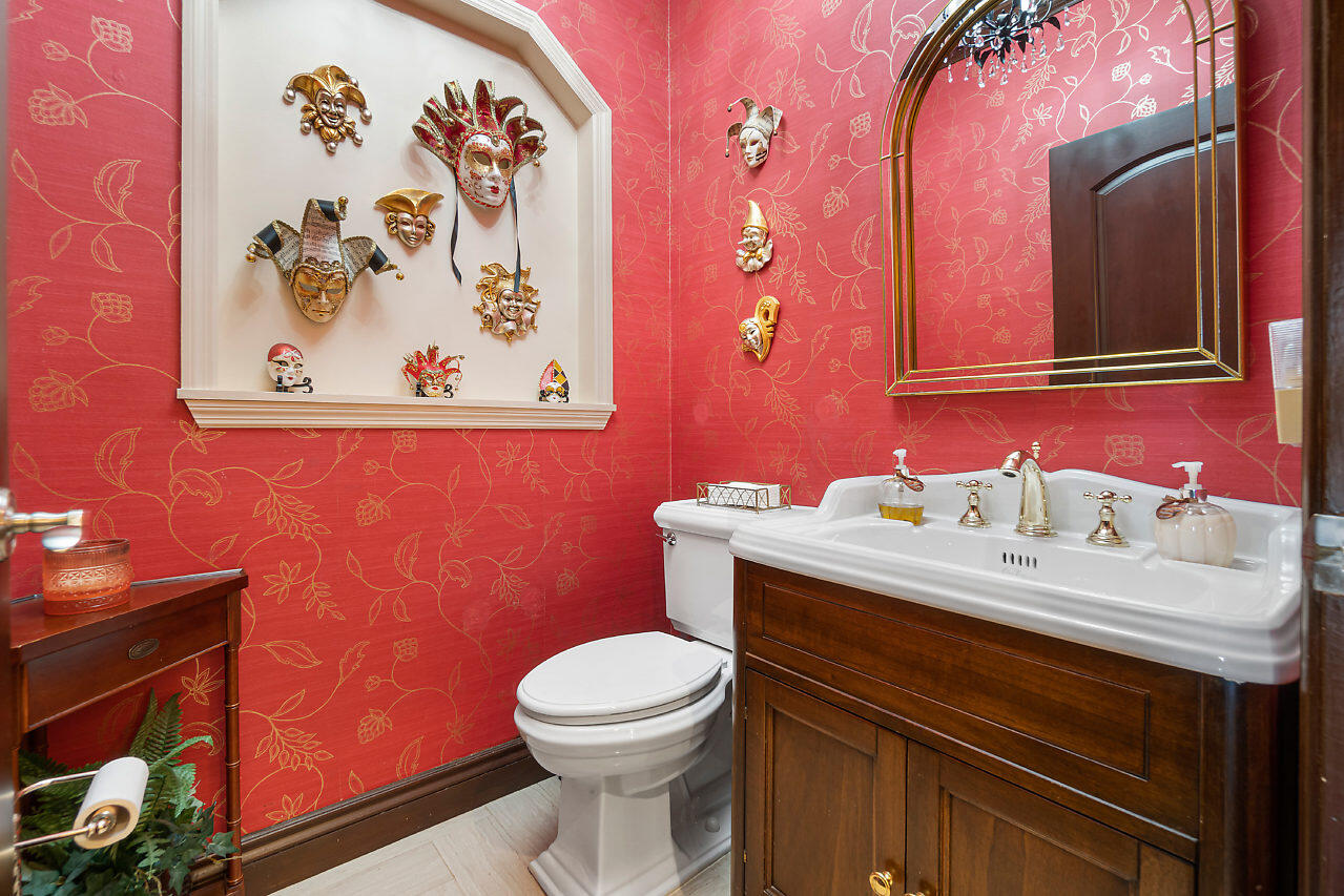4407 Woodfield Boulevard Boca Raton, FL 33434 - Photo 28 of 37 a bathroom with a sink mirror and toilet