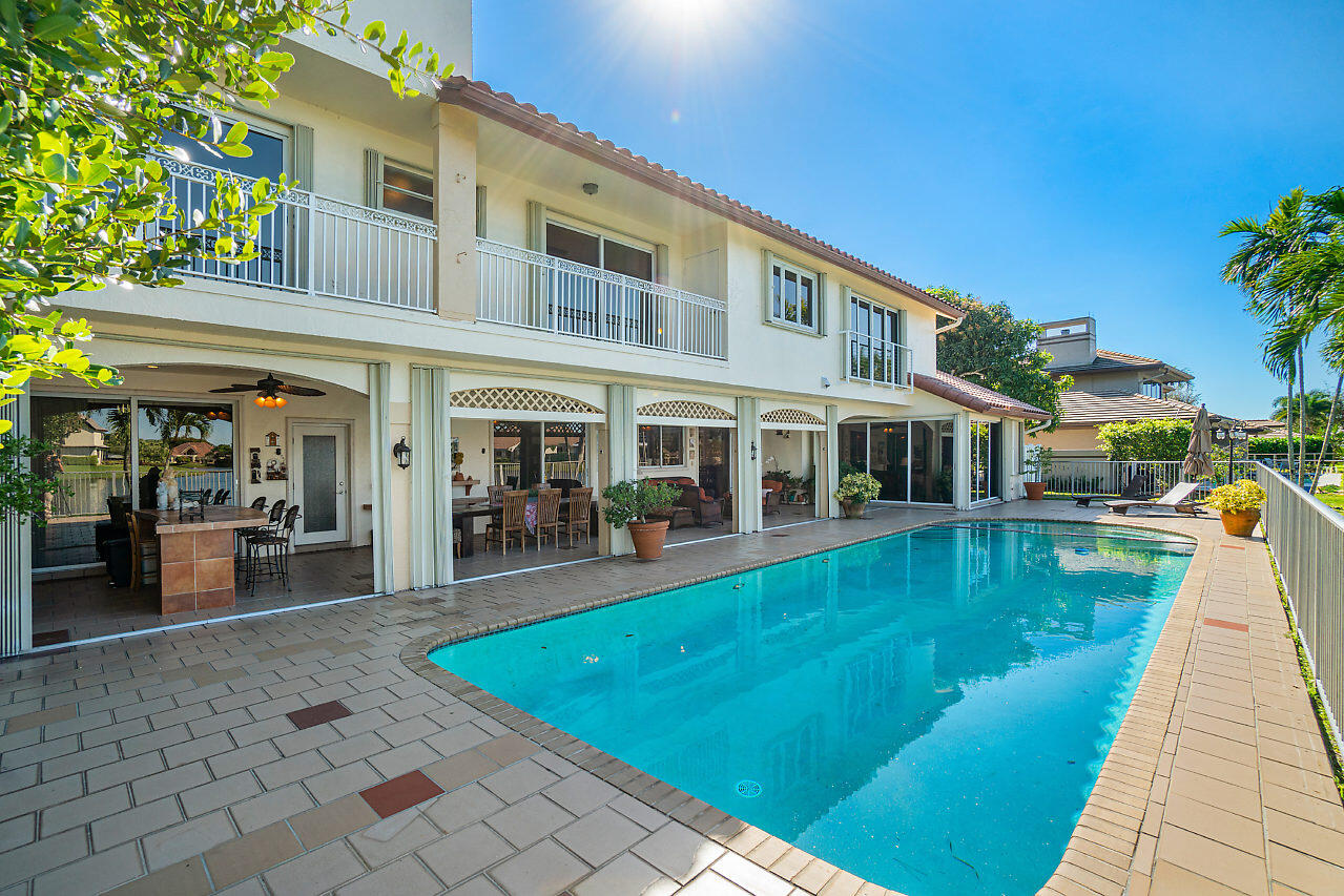 4407 Woodfield Boulevard Boca Raton, FL 33434 - Photo 35 of 37 a view of a house with swimming pool and sitting area
