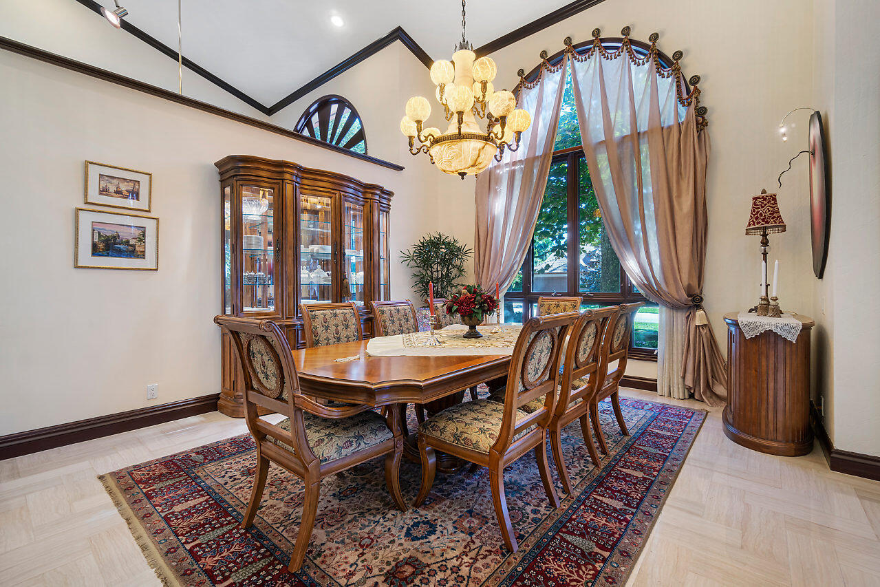 4407 Woodfield Boulevard Boca Raton, FL 33434 - Photo 6 of 37 a view of a dining room with furniture window and wooden floor