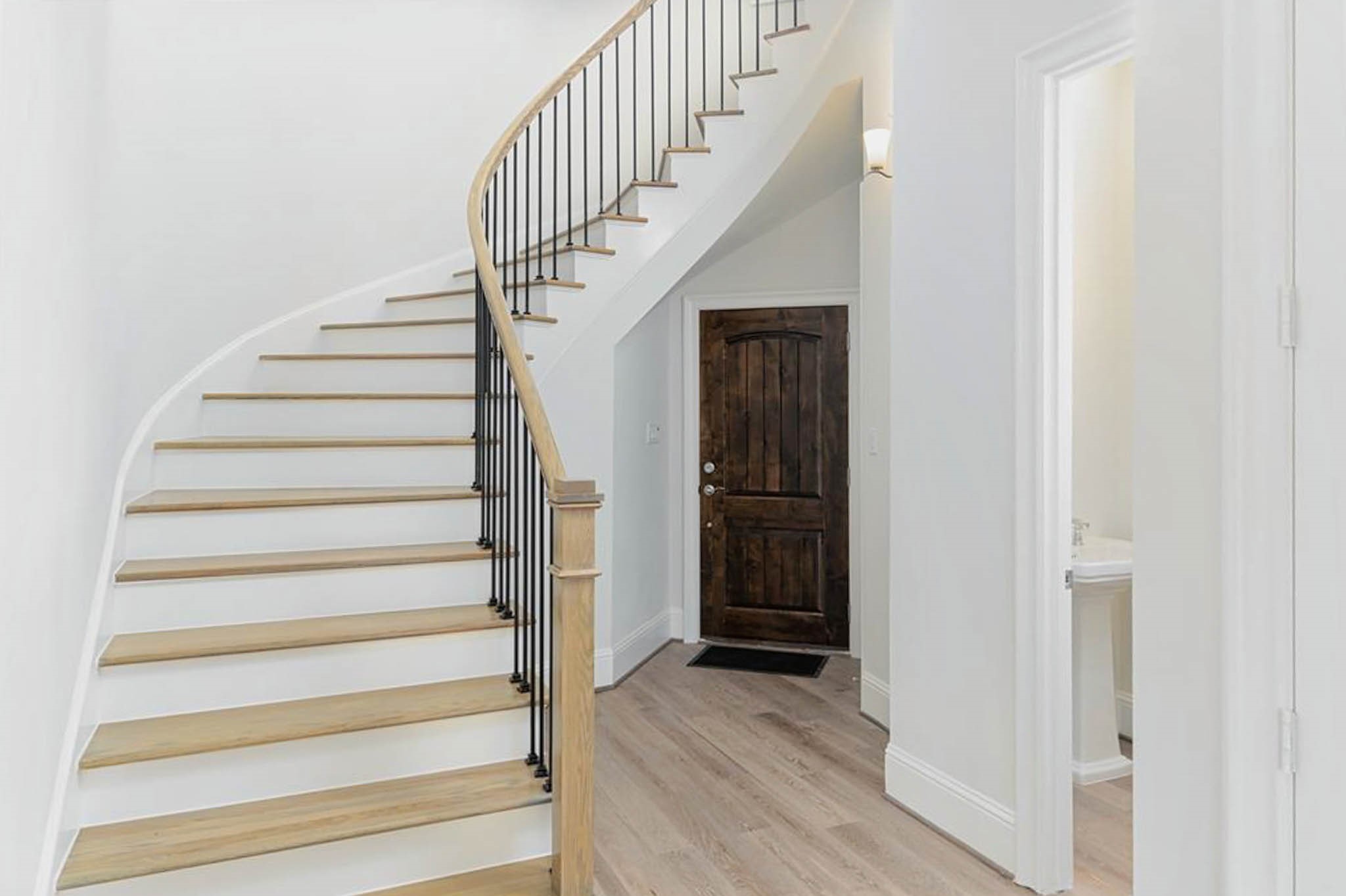 7715 South Fall Run Crossing Houston, TX 77055 - Photo 8 of 22 a view of entryway and gallery with wooden floor