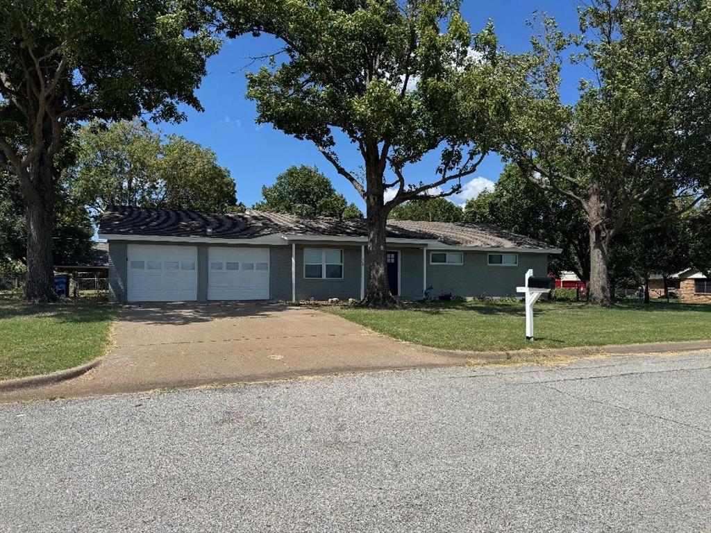 504 Pecan Street Crowley, TX 76036 - Photo 1 of 18 Ranch-style home with a front lawn, an attached garage, and concrete driveway
