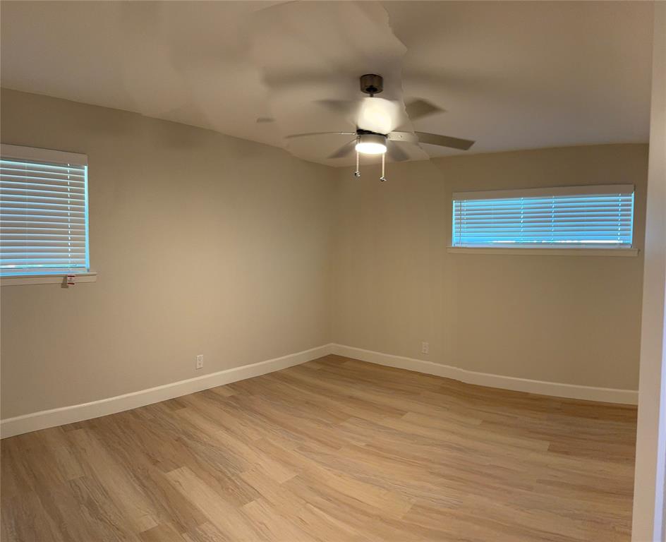 504 Pecan Street Crowley, TX 76036 - Photo 15 of 18 Spare room with light wood-style flooring and a ceiling fan