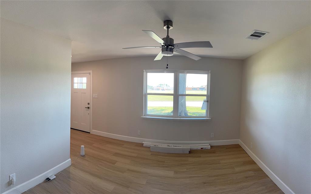 504 Pecan Street Crowley, TX 76036 - Photo 18 of 18 Spare room featuring light wood finished floors and ceiling fan