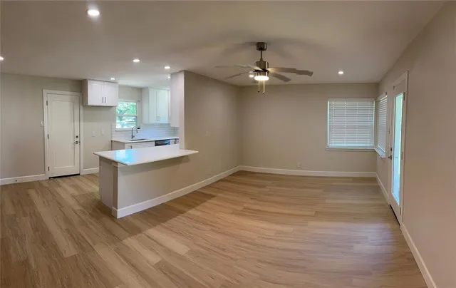 a view of a kitchen stairs and a microwave